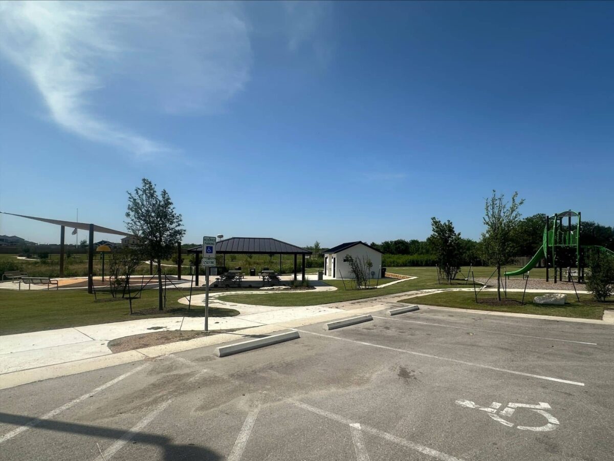 Marigold amenity park with pavilion, restroom building, and playground connected by walking paths.